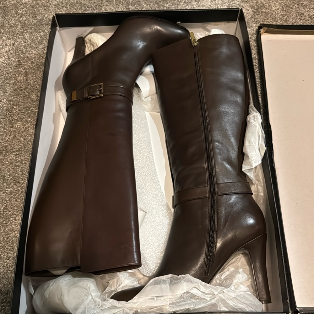 Dark brown med/high heel leather boots by Banana Republic. Never worn.